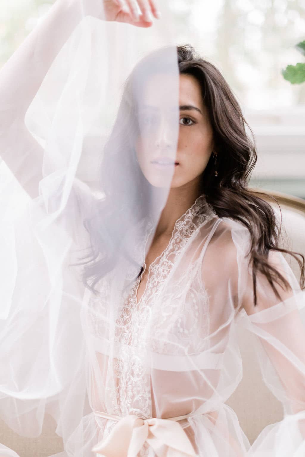 beautiful bride in soft makeup and voluminous wavy hair