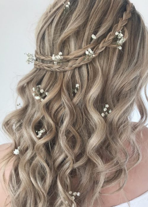 half up half down, curly bridal hairstyle with braids an flowers