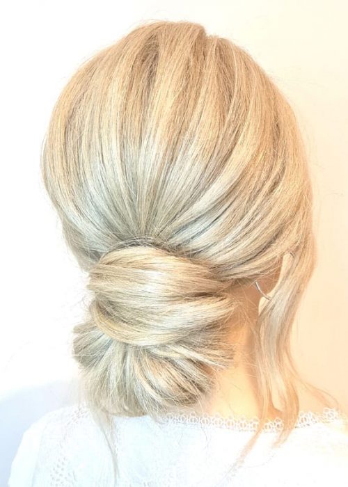 knot bun hairstyle with face framing pieces