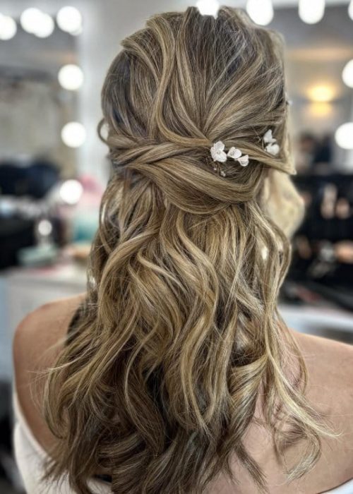 boho inspired relaxed wavy half up half down style on blonde hair